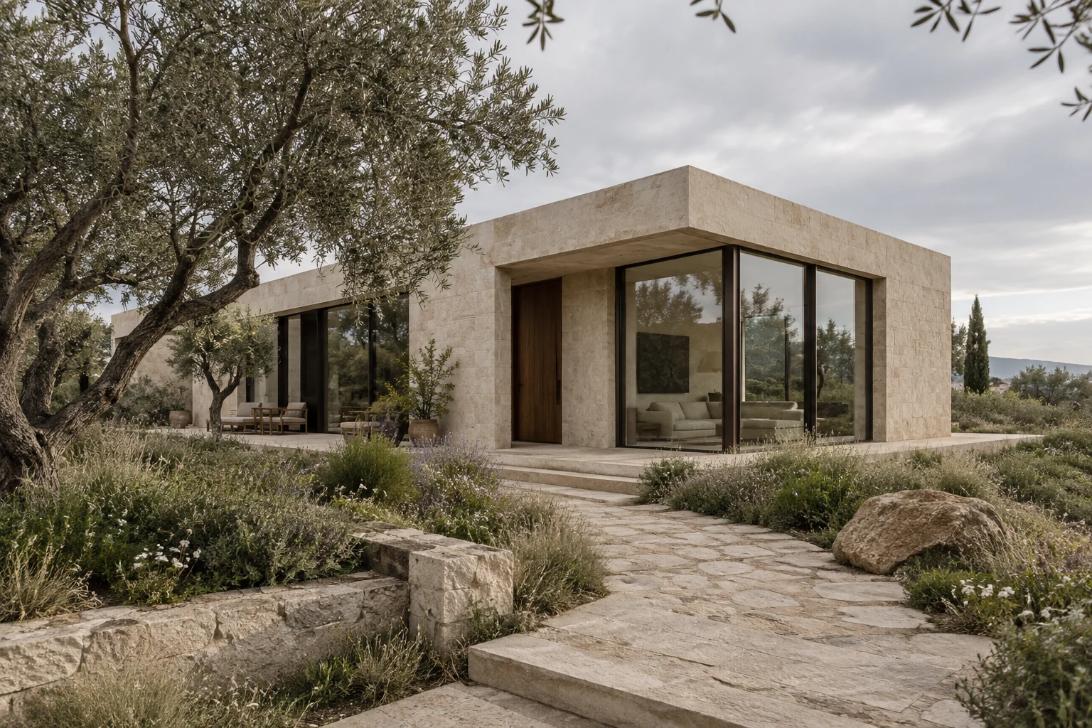 Contemporary limestone pavilion surrounded by olive trees